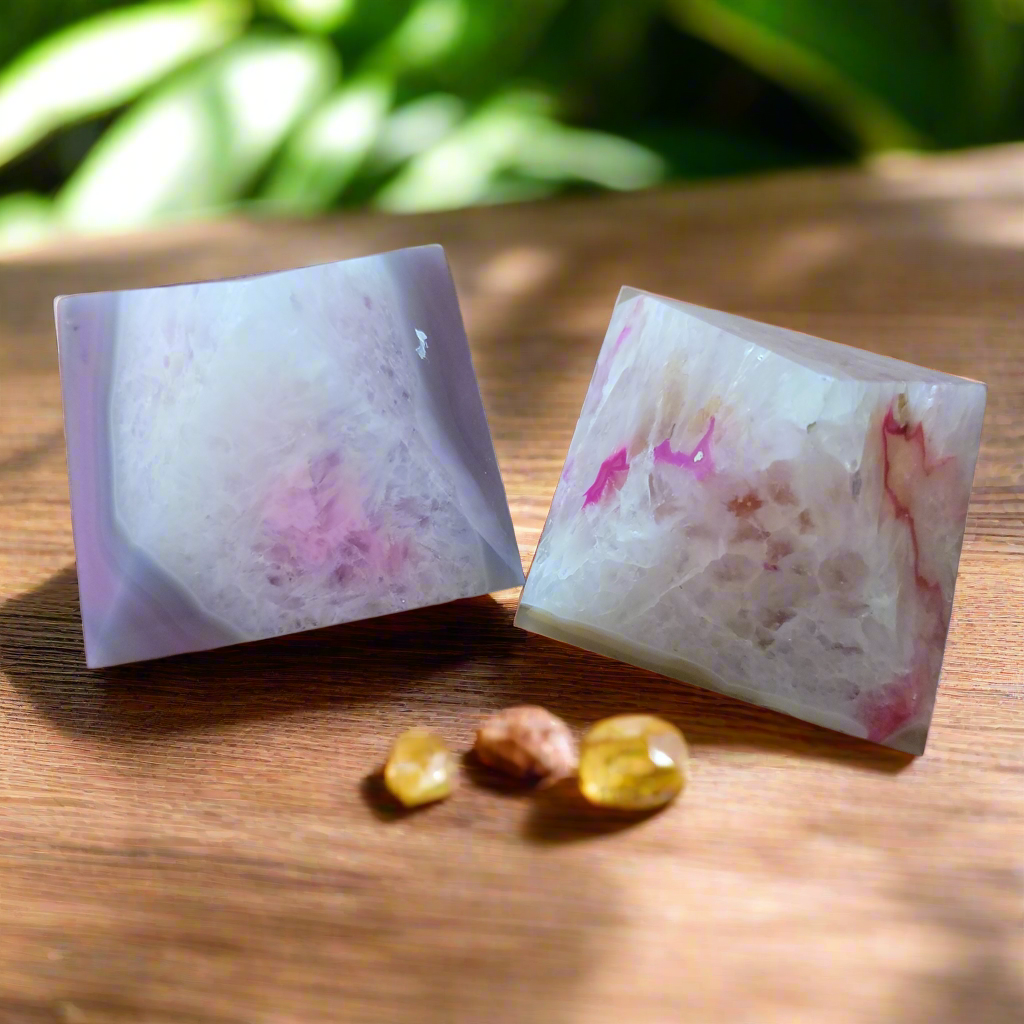 
Enhance your overall well-being and elevate your home decor with our Agate Pink Pyramid. Made of Pink Agate, known for its healing properties, this pyramid is a must-have for promoting health and wellness in your space. Add it to your collection of natural stones for a stylish and beneficial touch.