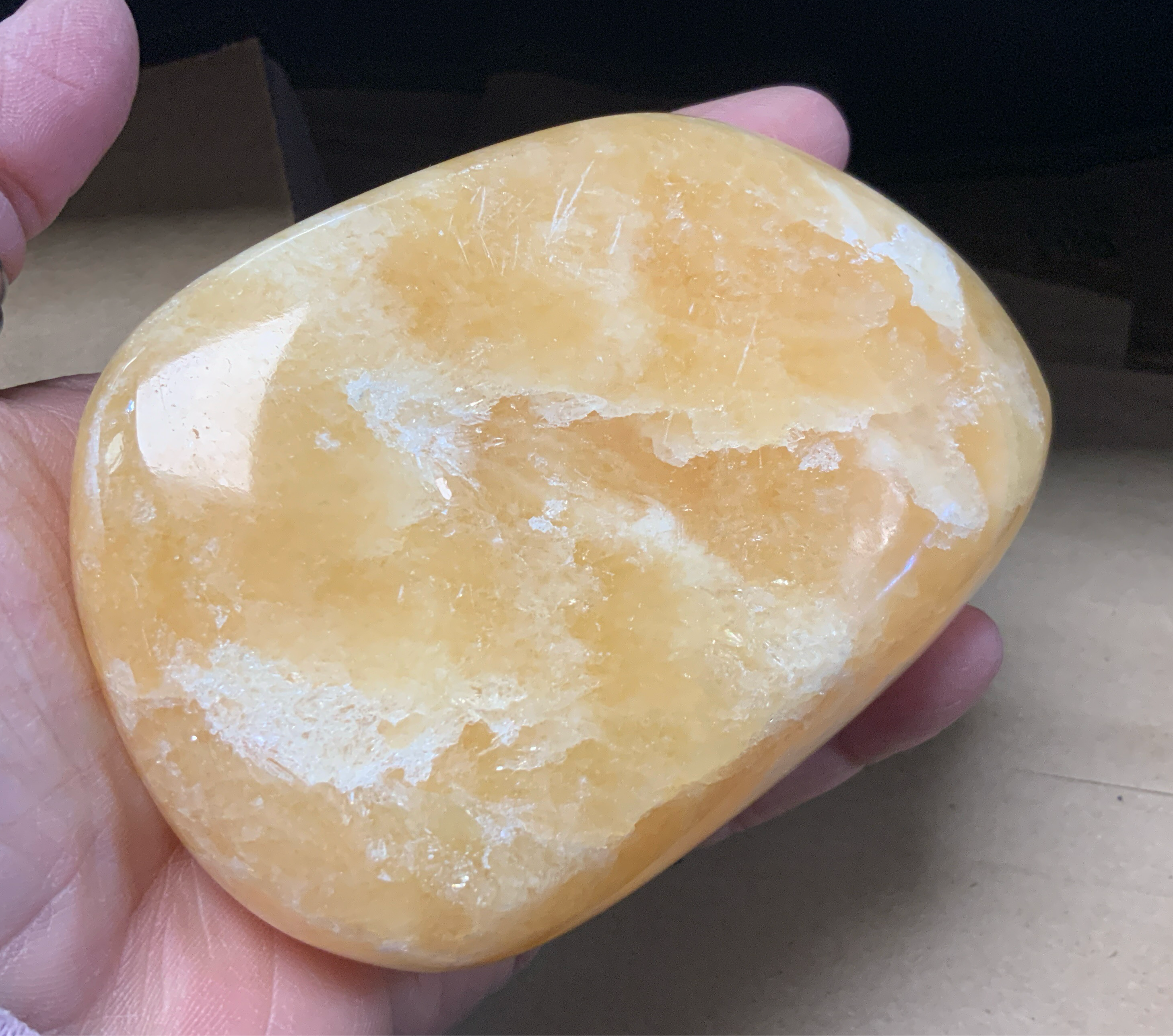This Large Orange Calcite Tumbled Stone boasts powerful healing properties. With its vibrant color and smooth texture, it's a must-have for crystal collectors and spiritual enthusiasts alike. With its ability to amplify energy and promote emotional balance, this tumbled stone is the perfect addition to any collection.