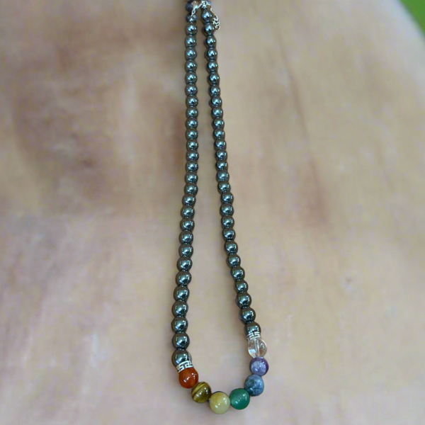 Enhance your well-being with our Beautiful Hematite Chakra Necklace. Made with hematite, a powerful grounding stone, this necklace promotes physical and emotional healing. Experience inner balance and harmony with this unique and elegant piece.