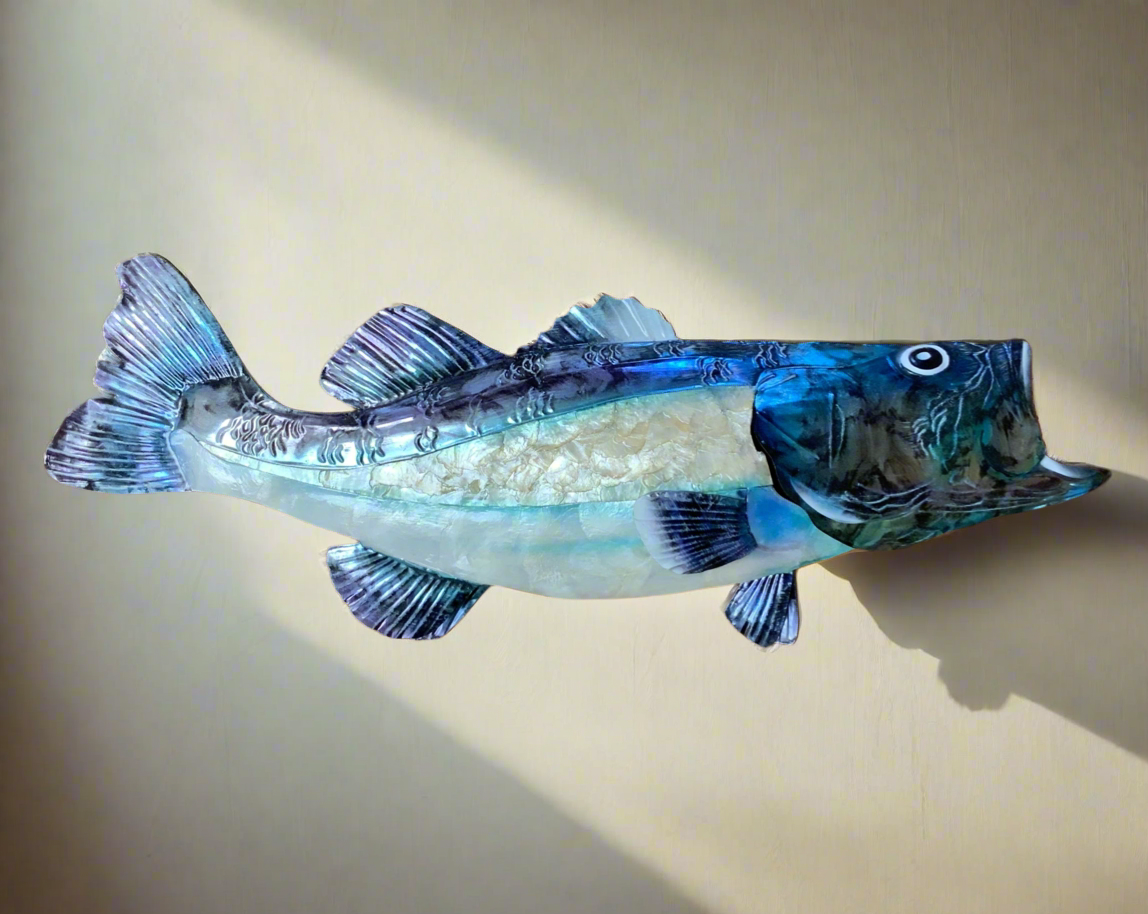 Made from a combination of metal and blue and white Capiz shells, this 12 inch long and 20 inch wide wall decor adds a beautiful touch to any home decor. Expertly crafted with a blend of durable metal and stunning blue and white Capiz shells, this wall decor measures 12 inches in length and 20 inches in width. Enhance the aesthetic of your living space with this exquisite piece.