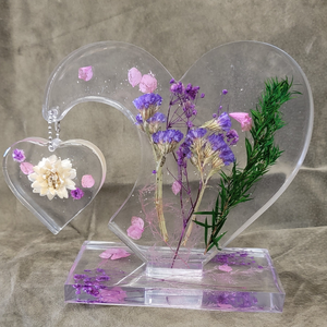 This handcrafted Resin Heart measures 7 inches tall and 8 inches wide, making it a beautiful and substantial addition to any space. Its unique design and expert craftsmanship are sure to impress. Perfect for adding a touch of elegance and charm to your home or office.