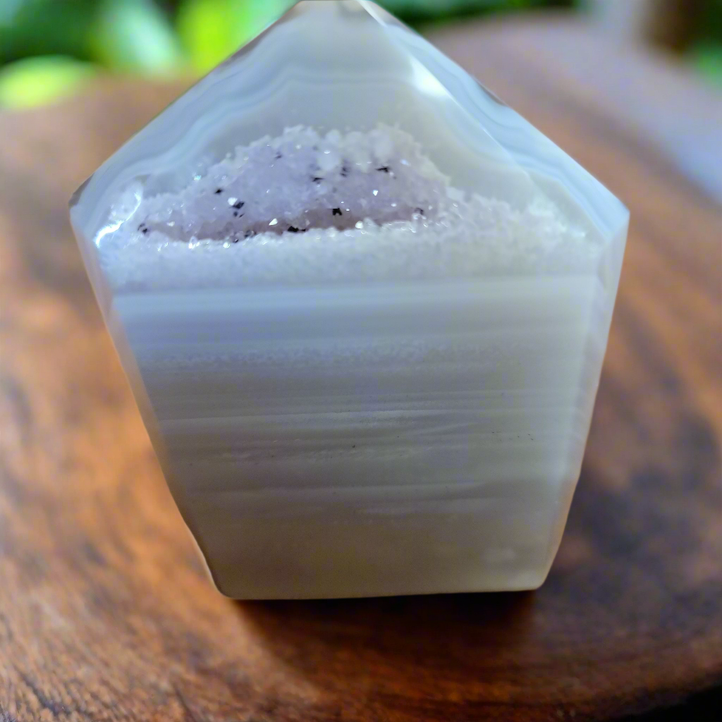 Discover the natural beauty of our Agate with Purple Druzy. This stunning home decor piece features a unique agate stone with a beautiful druzy crystal formation, adding a touch of elegance to any space. Elevate your home decor with this one-of-a-kind piece.