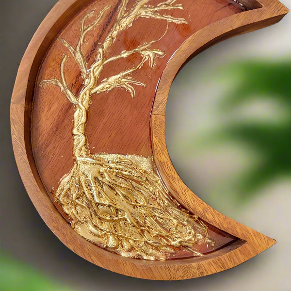 This 10 by 7 handcrafted wooden moon features a stunning tree of Life design and is lovingly adorned with resin details. The perfect addition to your home decor, this unique piece brings an element of natural beauty and artistic expression to any space.