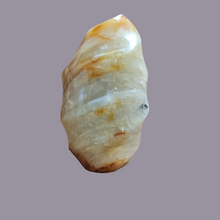 This Carnelian Flame from Madagascar is a stunning standing flame that will enhance any space. With its smooth, polished surface and fiery orange color, it brings a sense of warmth and vitality. Carnelian is known for its ability to boost energy, creativity, and motivation, making it a perfect addition to your home or office.This flame weighs approx. .815 kg