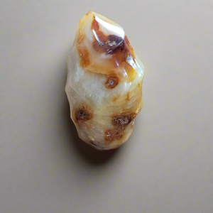 This Carnelian Flame from Madagascar is a stunning standing flame that will enhance any space. With its smooth, polished surface and fiery orange color, it brings a sense of warmth and vitality. Carnelian is known for its ability to boost energy, creativity, and motivation, making it a perfect addition to your home or office.This flame weighs approx. .815 kg