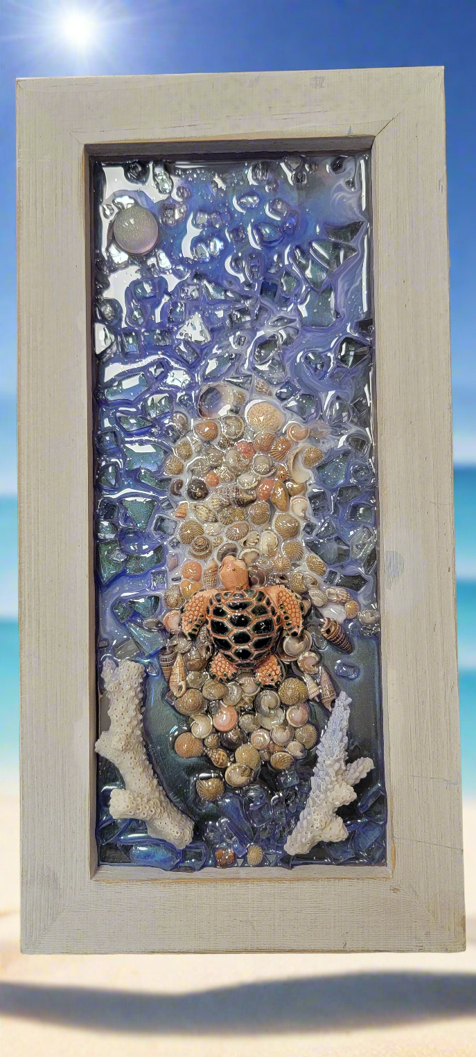 Experience the beauty of the ocean with our Turtle of the Sea Resin Picture. Each piece is uniquely handmade, capturing the intricate details of our beloved sea turtles. Made with resin art and framed to perfection, this 5 by 11 inch picture is a must-have for any marine enthusiast.