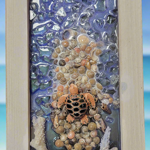 Experience the beauty of the ocean with our Turtle of the Sea Resin Picture. Each piece is uniquely handmade, capturing the intricate details of our beloved sea turtles. Made with resin art and framed to perfection, this 5 by 11 inch picture is a must-have for any marine enthusiast.