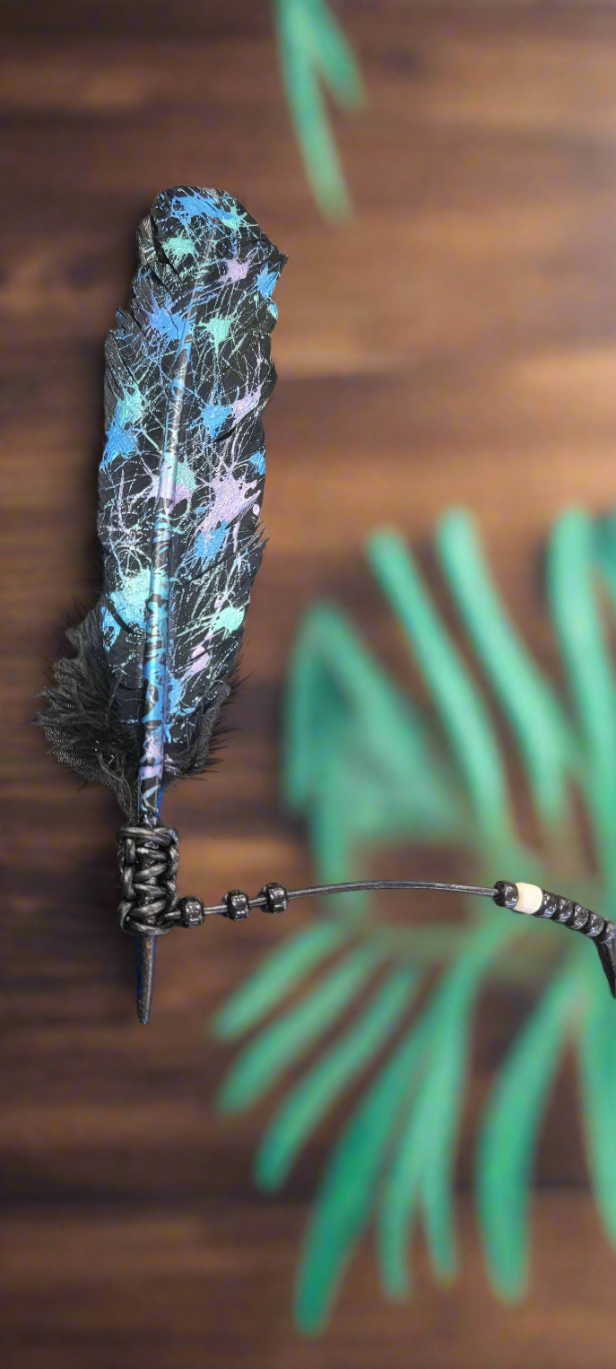 Expertly crafted by artist Cathy Saxton, these distinctive hand painted feathers are a one-of-a-kind addition to any collection. Each piece is uniquely designed and painted, making it a beautiful and artistic statement piece for any home or office. Bring a touch of nature and creativity to your space with these stunning hand painted feathers.