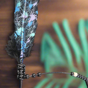 Expertly crafted by artist Cathy Saxton, these distinctive hand painted feathers are a one-of-a-kind addition to any collection. Each piece is uniquely designed and painted, making it a beautiful and artistic statement piece for any home or office. Bring a touch of nature and creativity to your space with these stunning hand painted feathers.