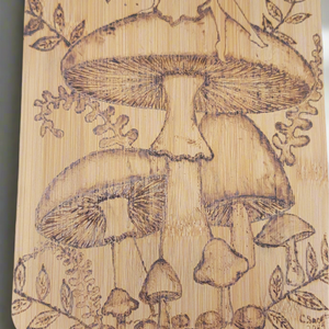 Expertly crafted by artist Cathy, this Fairy on a Mushroom plaque is a stunning addition to any home. Handmade with care, this beautiful piece showcases Cathy's skilled craftsmanship and attention to detail. A unique and charming decoration, perfect for any fairy lover.