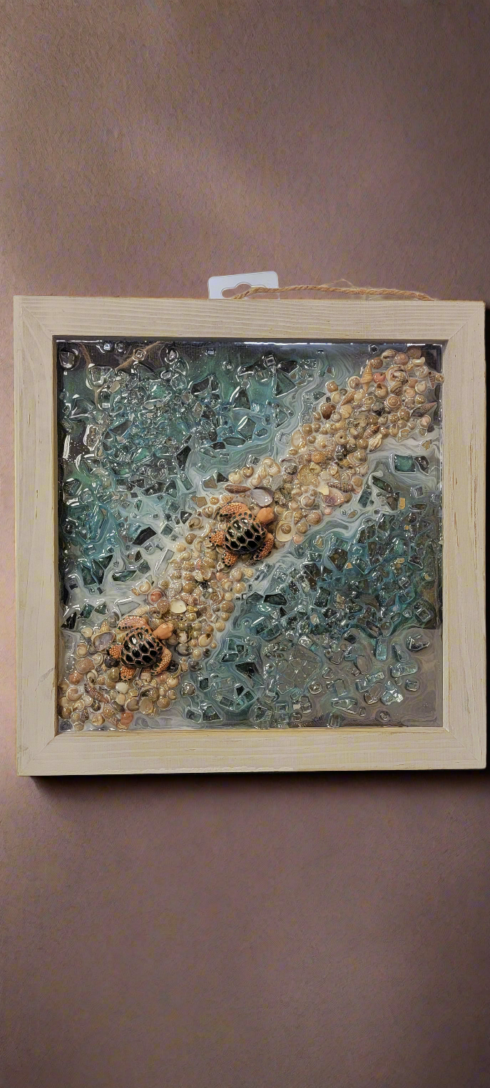 Introduce beautiful sea turtles into your home decor with this handmade resin picture by Shirley Blade. Measuring 12 by 12 inches, this unique piece adds a touch of nature to any space. Experience the calming presence of these mesmerizing creatures with this one-of-a-kind artwork.