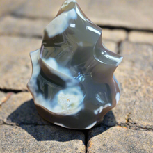 This exquisite Chalcedony Flame, weighing 1.26 KG, is a stunning addition to any collection. With its unique and beautiful features, it is sure to capture attention and add a touch of elegance to any space. Crafted with precision and expertly designed, it is a must-have for any product or crystal enthusiast.