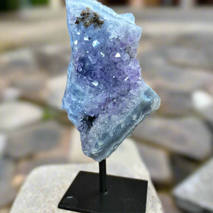 As a product expert, I can confidently state that our Amethyst on a Stand boasts a stunning display of brilliant color. Each piece is hand-selected for its vibrant hues, ensuring a bold and unique addition to any collection. Transform your space with this natural wonder.Beautiful Amethyst on a pin stand measure approx 6.5 inches tall