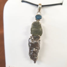 Experience the healing power of our Beautiful Moldavite Necklace! This stunning piece is made with genuine indigo kyanite, moldavite, and Campo Del Cielo meteorite. The indigo kyanite promotes spiritual growth and the moldavite is known for its transformative abilities. This necklace is sure to bring balance and positive energy into your life.