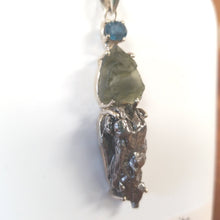 Experience the healing power of our Beautiful Moldavite Necklace! This stunning piece is made with genuine indigo kyanite, moldavite, and Campo Del Cielo meteorite. The indigo kyanite promotes spiritual growth and the moldavite is known for its transformative abilities. This necklace is sure to bring balance and positive energy into your life.