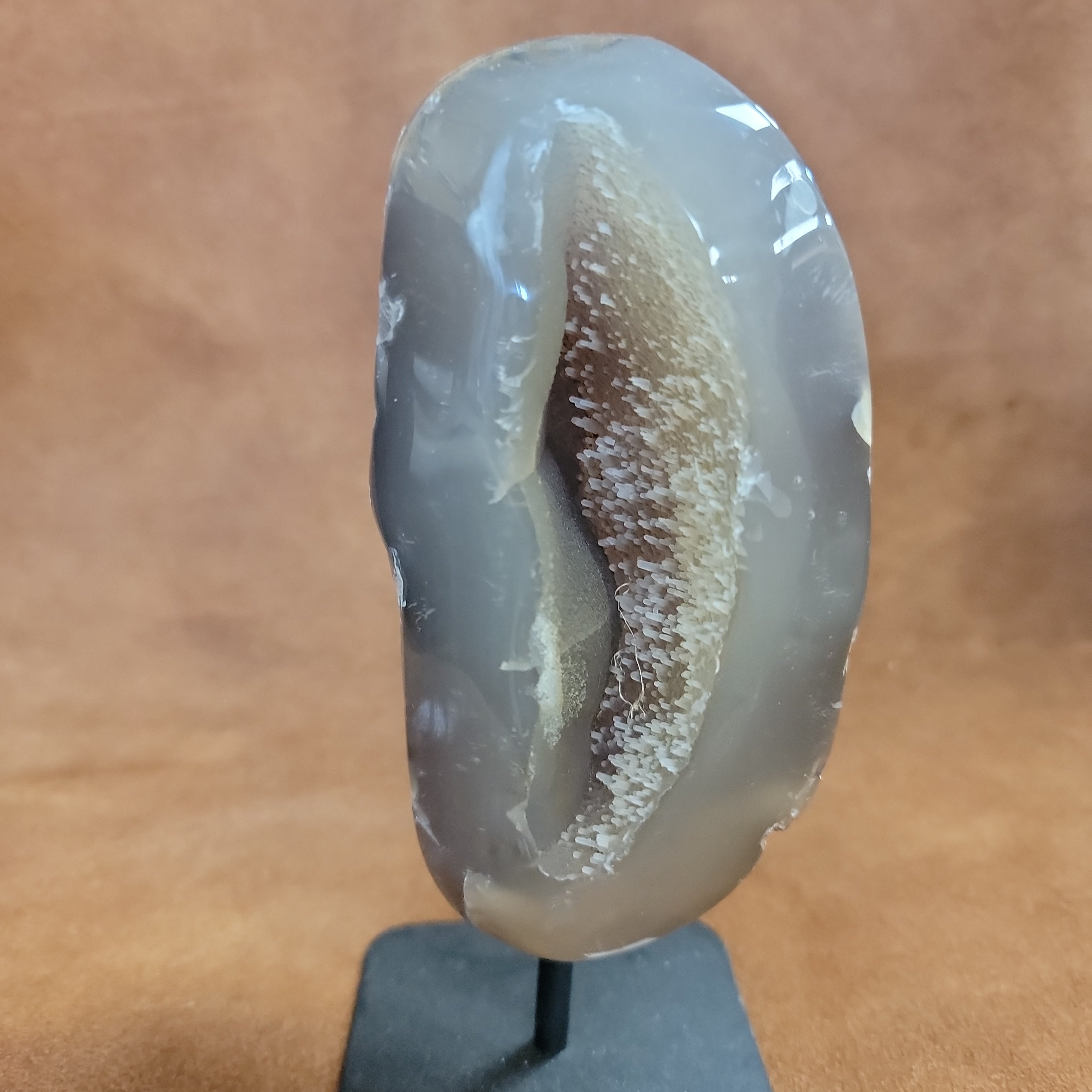 
Add natural beauty and spiritual energy to your home decor with our Agate Specimen on Stand. This geode specimen is mounted on a pin for easy display and its unique patterns make it a stunning addition to any room. Bring a touch of nature and positivity into your space with this beautiful and meaningful piece.
