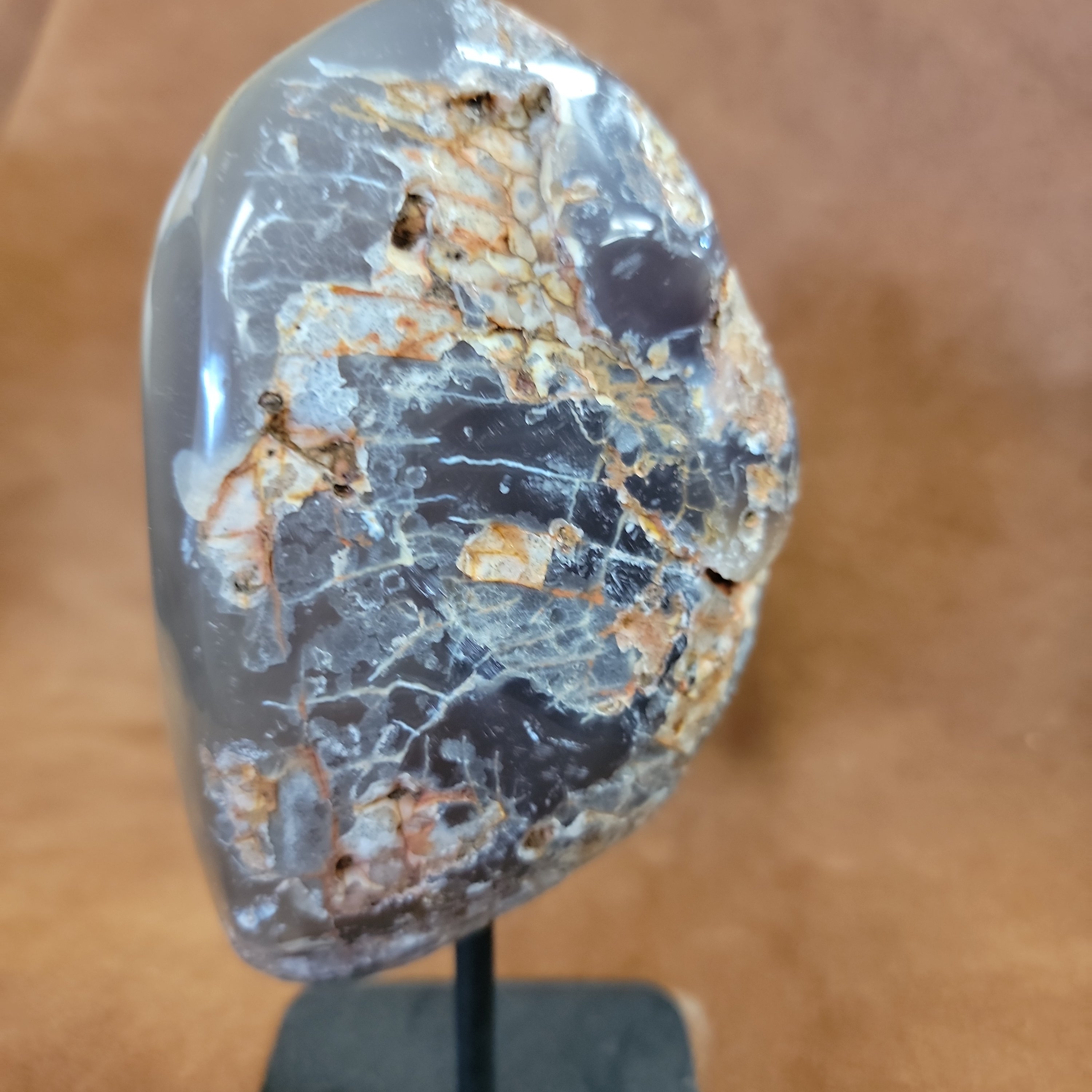 
Add natural beauty and spiritual energy to your home decor with our Agate Specimen on Stand. This geode specimen is mounted on a pin for easy display and its unique patterns make it a stunning addition to any room. Bring a touch of nature and positivity into your space with this beautiful and meaningful piece.