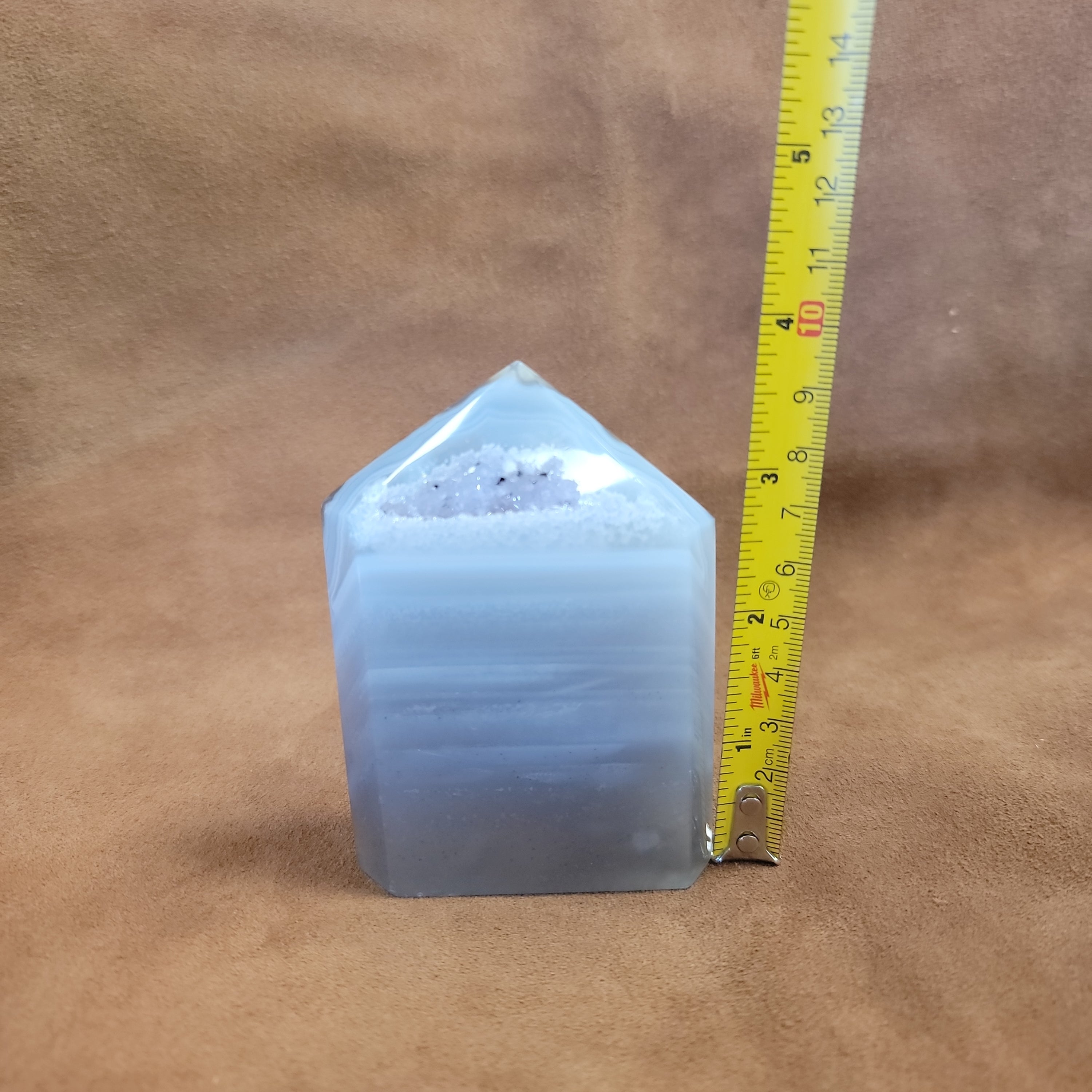 Discover the natural beauty of our Agate with Purple Druzy. This stunning home decor piece features a unique agate stone with a beautiful druzy crystal formation, adding a touch of elegance to any space. Elevate your home decor with this one-of-a-kind piece.