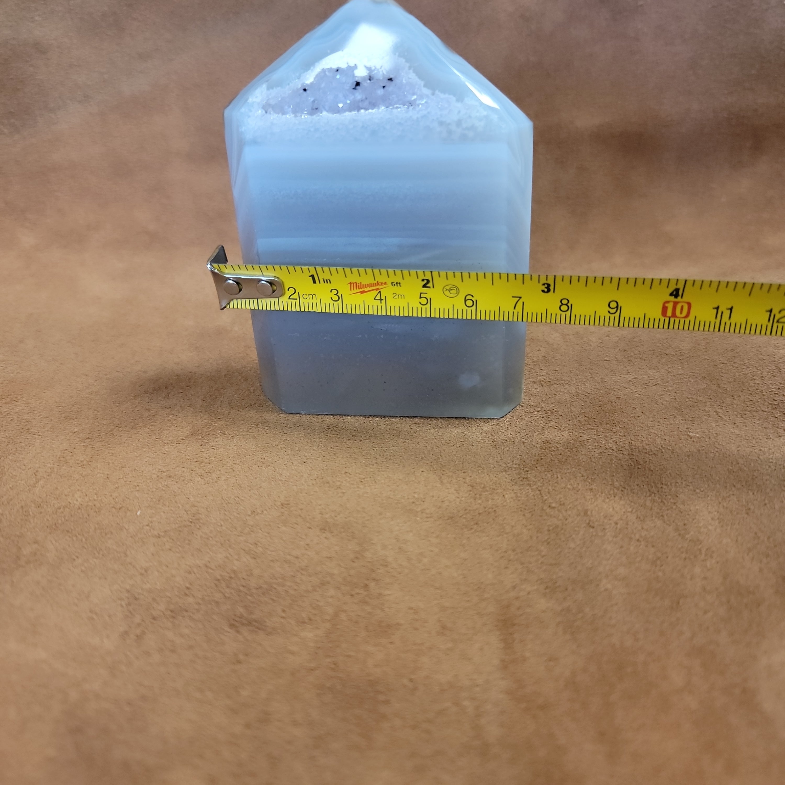 Discover the natural beauty of our Agate with Purple Druzy. This stunning home decor piece features a unique agate stone with a beautiful druzy crystal formation, adding a touch of elegance to any space. Elevate your home decor with this one-of-a-kind piece.