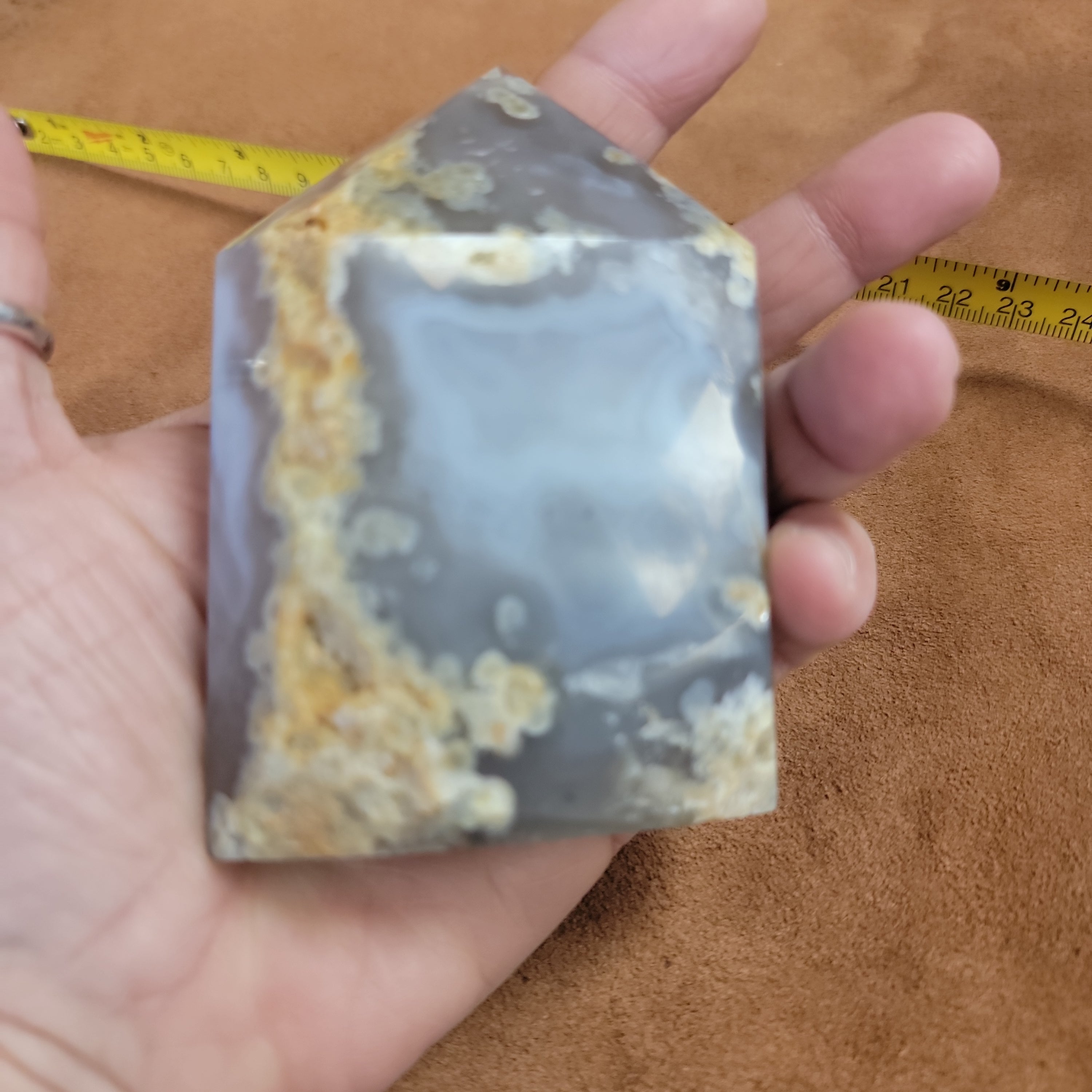 Discover the natural beauty of our Agate with Purple Druzy. This stunning home decor piece features a unique agate stone with a beautiful druzy crystal formation, adding a touch of elegance to any space. Elevate your home decor with this one-of-a-kind piece.