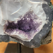 Elevate your home decor with our stunning Amethyst Speciman, featuring a beautiful purple hue and a sleek metal base. Bring a touch of elegance to any room with this unique and eye-catching centerpiece. Perfect for adding a sophisticated and calming atmosphere to your living space.