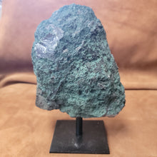 Elevate your home decor with our stunning Amethyst Speciman, featuring a beautiful purple hue and a sleek metal base. Bring a touch of elegance to any room with this unique and eye-catching centerpiece. Perfect for adding a sophisticated and calming atmosphere to your living space.