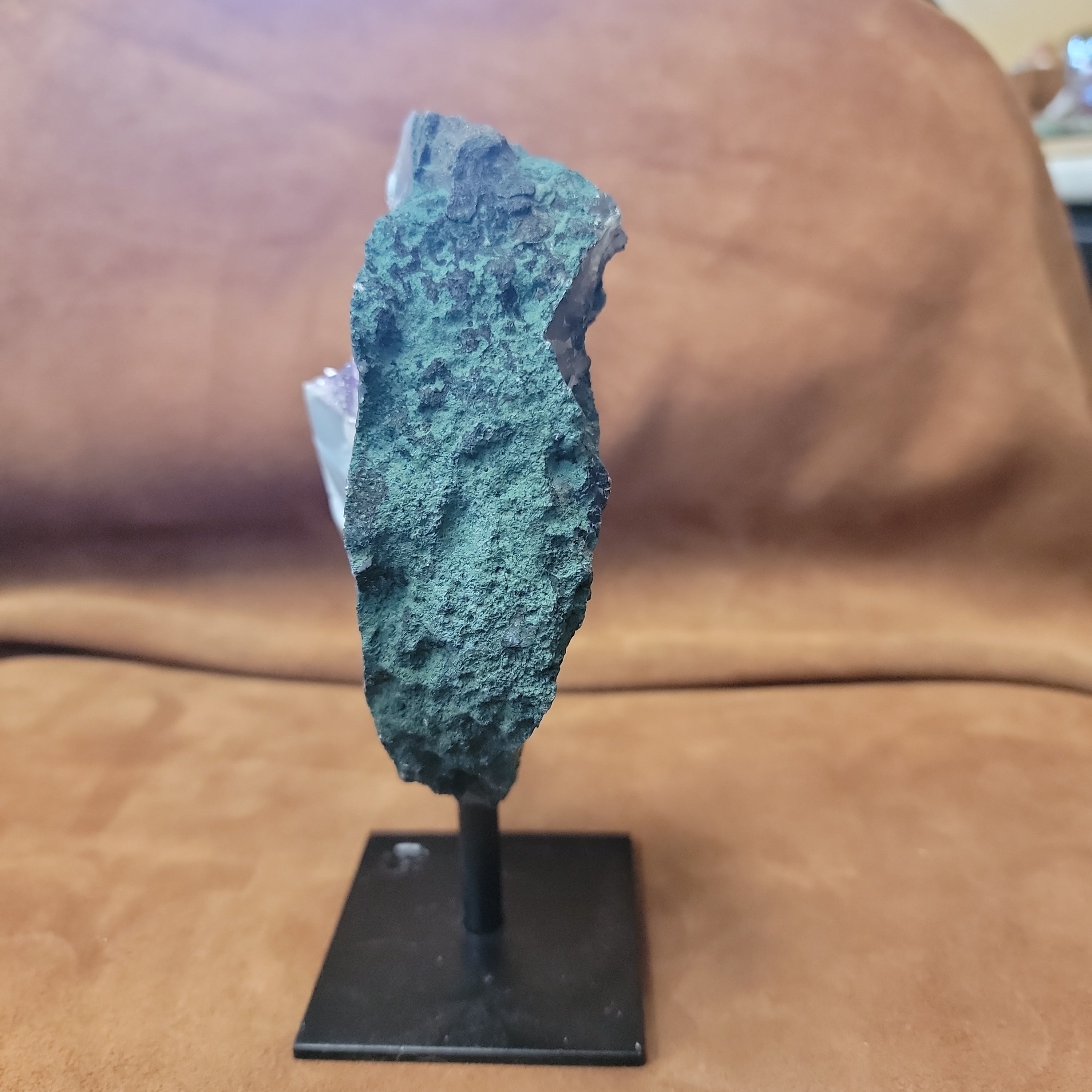 Experience the natural beauty and positive energy of our Amethyst Speciman with metal base. This carefully selected crystal is delicately pinned for home decor, bringing a touch of elegance and grounding energy to any space. Embrace the benefits of Amethyst, known for its calming and healing properties.