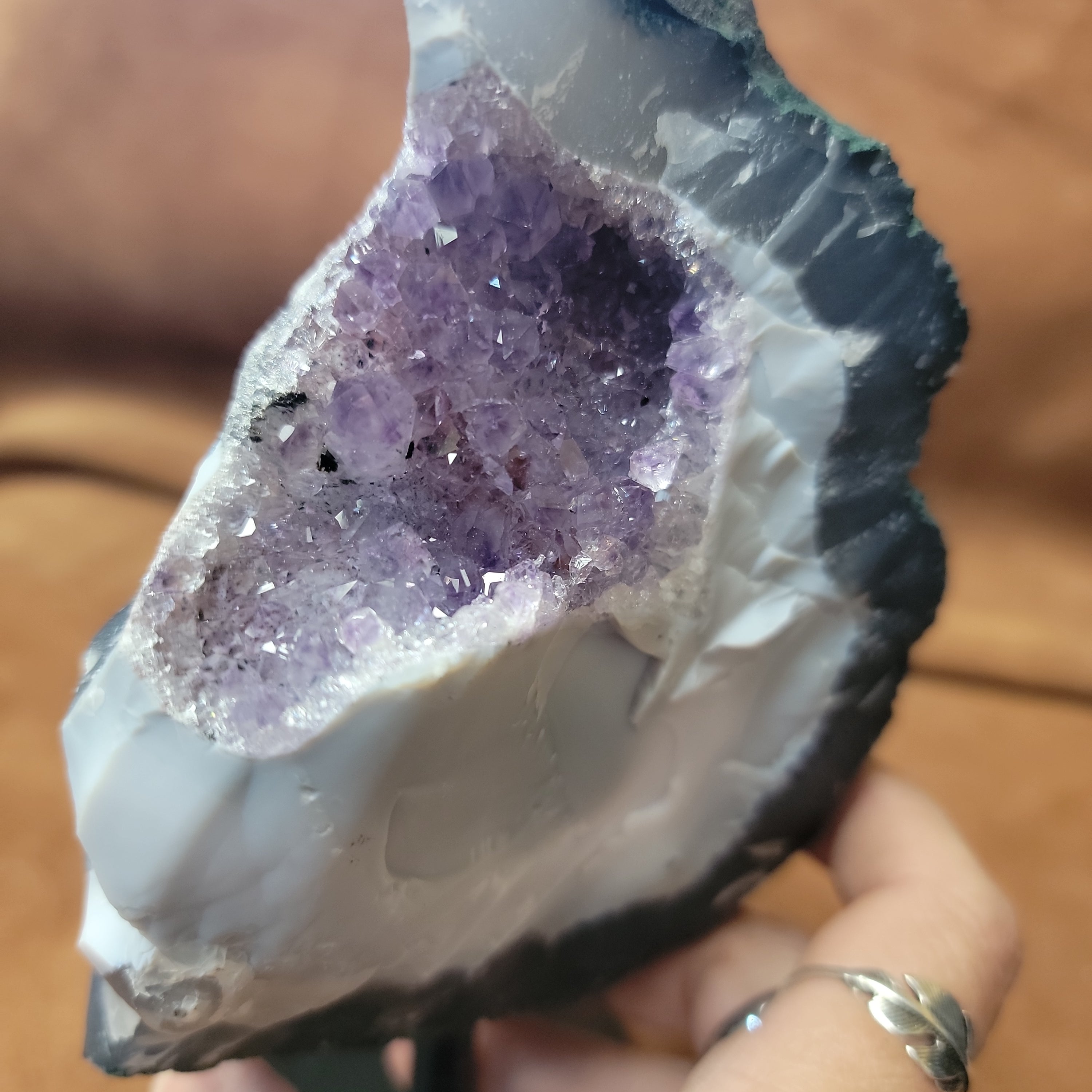 Experience the natural beauty and positive energy of our Amethyst Speciman with metal base. This carefully selected crystal is delicately pinned for home decor, bringing a touch of elegance and grounding energy to any space. Embrace the benefits of Amethyst, known for its calming and healing properties.