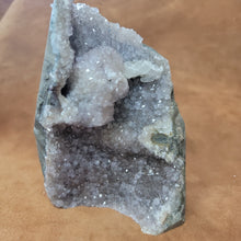 The Amethyst Speciman is a stunning addition to any collection. Its naturally freeform shape showcases the unique beauty of amethyst, making it a one-of-a-kind piece. With its captivating appearance and alluring purple hue, this specimen is sure to be a standout in any setting.Amythest Speciman