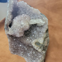 The Amethyst Speciman is a stunning addition to any collection. Its naturally freeform shape showcases the unique beauty of amethyst, making it a one-of-a-kind piece. With its captivating appearance and alluring purple hue, this specimen is sure to be a standout in any setting.Amythest Speciman