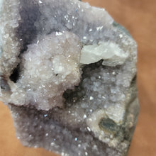 The Amethyst Speciman is a stunning addition to any collection. Its naturally freeform shape showcases the unique beauty of amethyst, making it a one-of-a-kind piece. With its captivating appearance and alluring purple hue, this specimen is sure to be a standout in any setting.Amythest Speciman