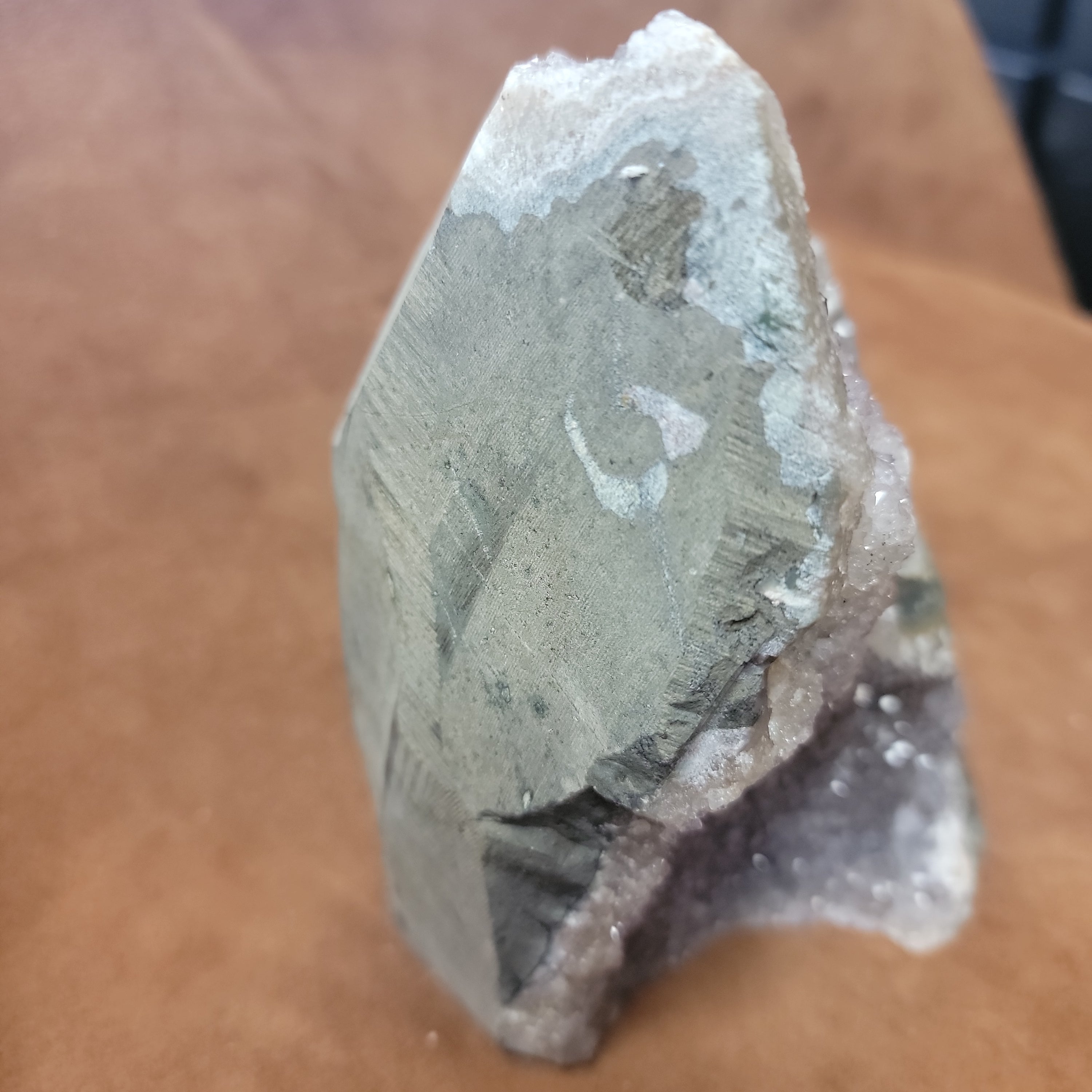 The Amethyst Speciman is a stunning addition to any collection. Its naturally freeform shape showcases the unique beauty of amethyst, making it a one-of-a-kind piece. With its captivating appearance and alluring purple hue, this specimen is sure to be a standout in any setting.Amythest Speciman