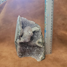 The Amethyst Speciman is a stunning addition to any collection. Its naturally freeform shape showcases the unique beauty of amethyst, making it a one-of-a-kind piece. With its captivating appearance and alluring purple hue, this specimen is sure to be a standout in any setting.Amythest Speciman
