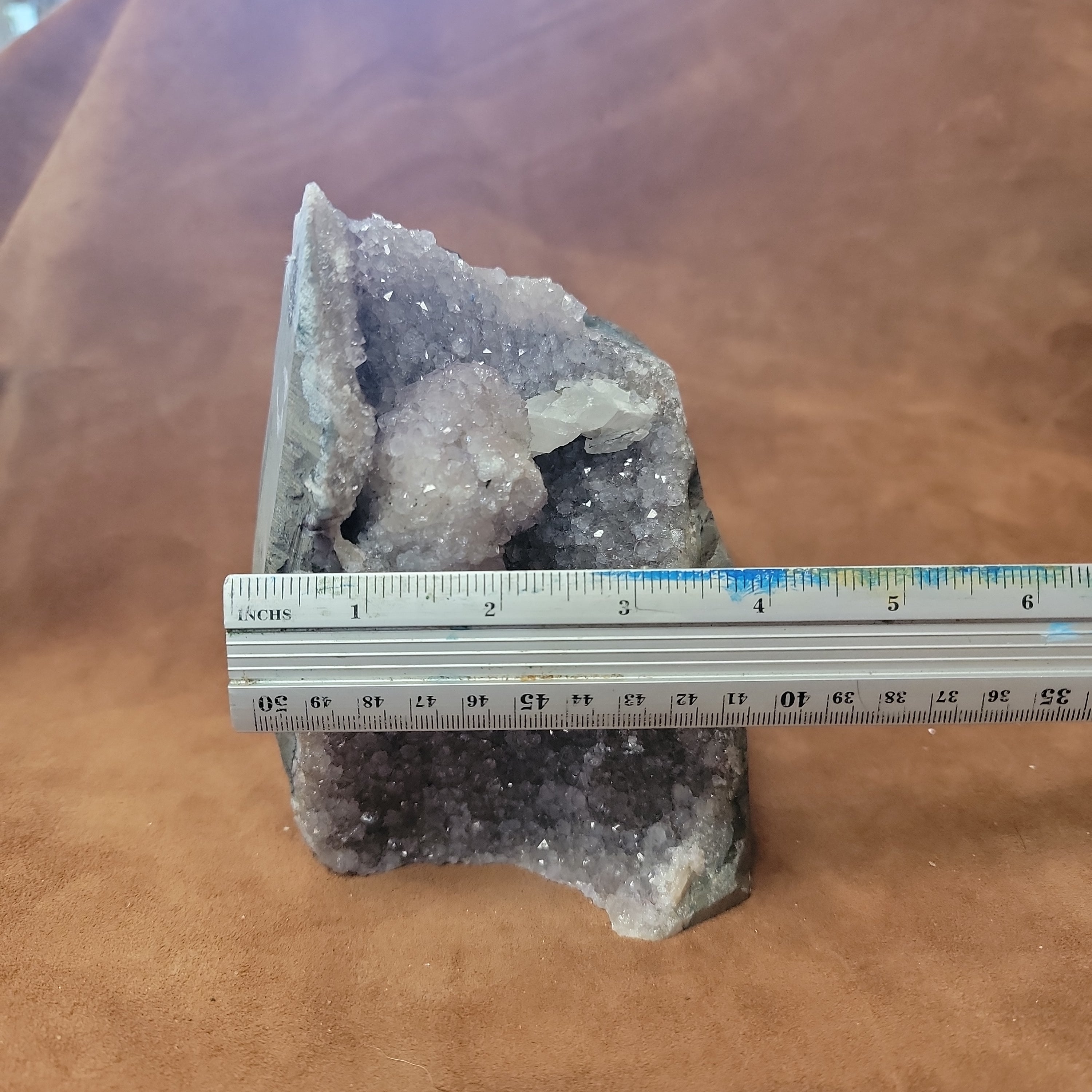 The Amethyst Speciman is a stunning addition to any collection. Its naturally freeform shape showcases the unique beauty of amethyst, making it a one-of-a-kind piece. With its captivating appearance and alluring purple hue, this specimen is sure to be a standout in any setting.Amythest Speciman