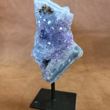As a product expert, I can confidently state that our Amethyst on a Stand boasts a stunning display of brilliant color. Each piece is hand-selected for its vibrant hues, ensuring a bold and unique addition to any collection. Transform your space with this natural wonder.Beautiful Amethyst on a pin stand measure approx 6.5 inches tall