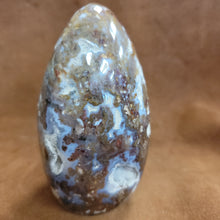 This exquisite Agate Freeform is a statement piece that will elevate any home decor. Meticulously crafted from natural agate, its unique free-form design showcases the stunning patterns and colors of this beautiful gemstone. Add a touch of natural elegance to your living space with this beautiful Agate Freeform.This agate freeform weighs approx. 1.220 kg