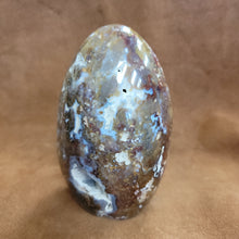 This exquisite Agate Freeform is a statement piece that will elevate any home decor. Meticulously crafted from natural agate, its unique free-form design showcases the stunning patterns and colors of this beautiful gemstone. Add a touch of natural elegance to your living space with this beautiful Agate Freeform.This agate freeform weighs approx. 1.220 kg