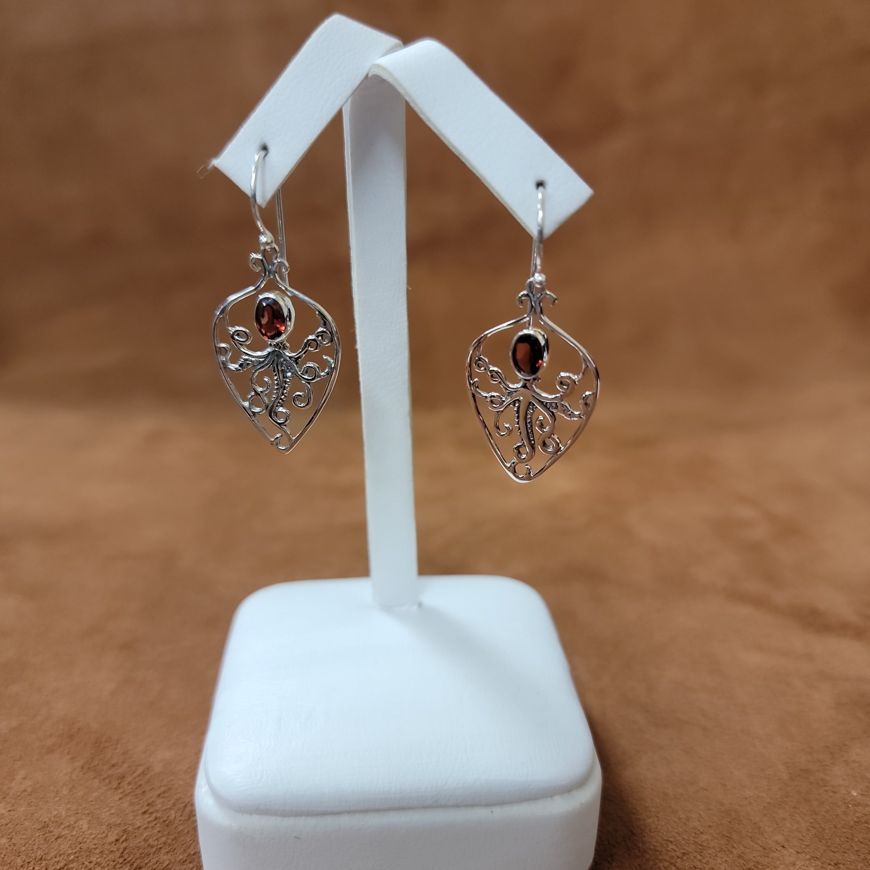 Vera Wolf Sterling Silver Earrings Octopus with Ruby Colored Stone