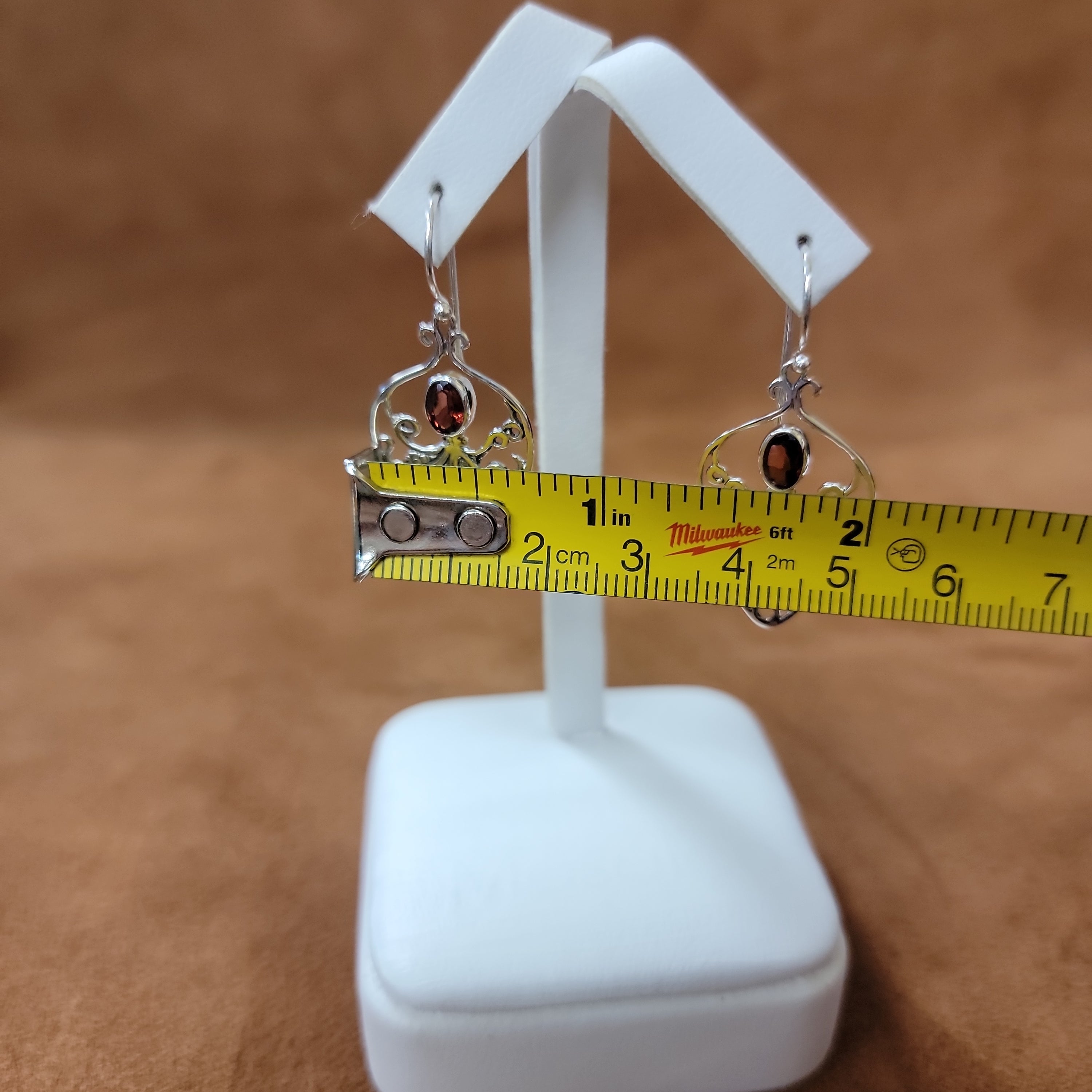 Vera Wolf Sterling Silver Earrings Octopus with Ruby Colored Stone