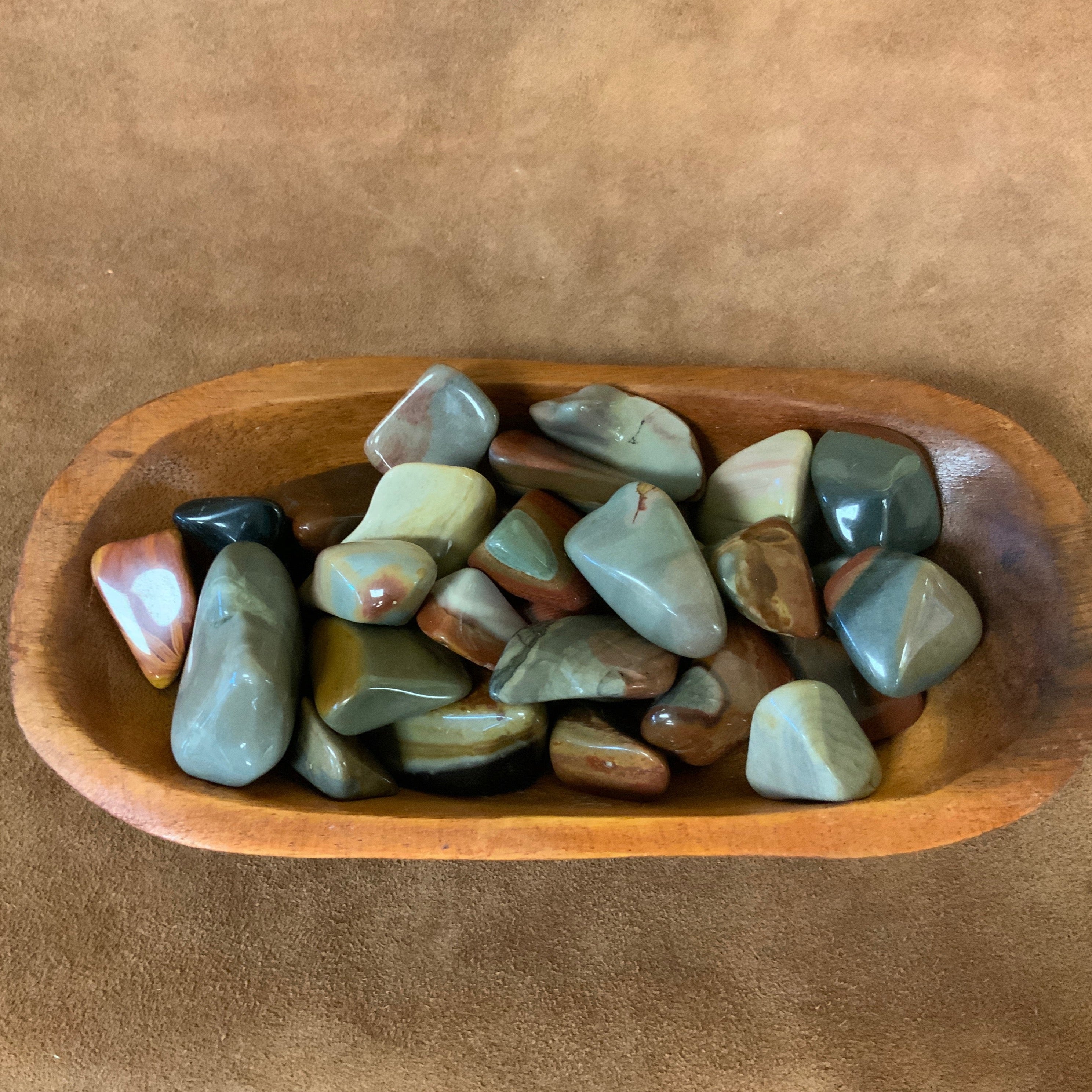 Introducing Desert Jasper tumbled stones, an essential addition to any crystal collection. These stones are expertly sourced and tumbled to reveal their unique patterns and soothing energy. Perfect for grounding and promoting tranquility, these stones are a must-have for meditation and relaxation.