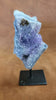 As a product expert, I can confidently state that our Amethyst on a Stand boasts a stunning display of brilliant color. Each piece is hand-selected for its vibrant hues, ensuring a bold and unique addition to any collection. Transform your space with this natural wonder.Beautiful Amethyst on a pin stand measure approx 6.5 inches tall