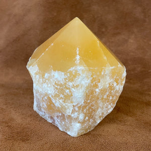 Orange calcite polished point