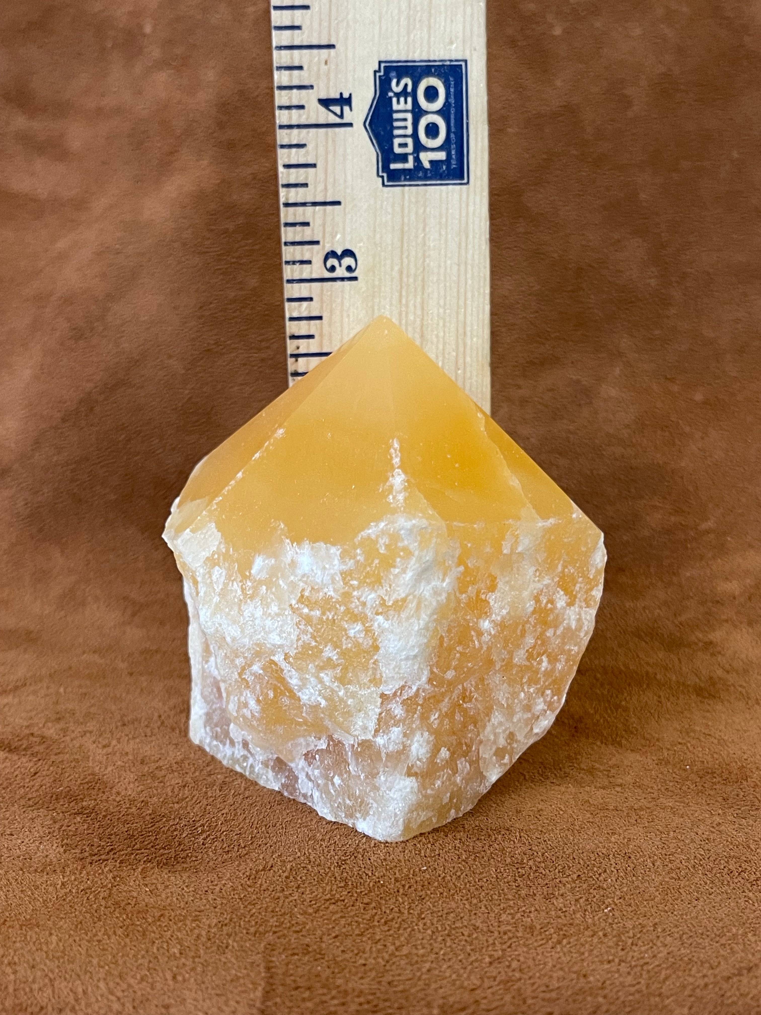 Orange calcite polished point