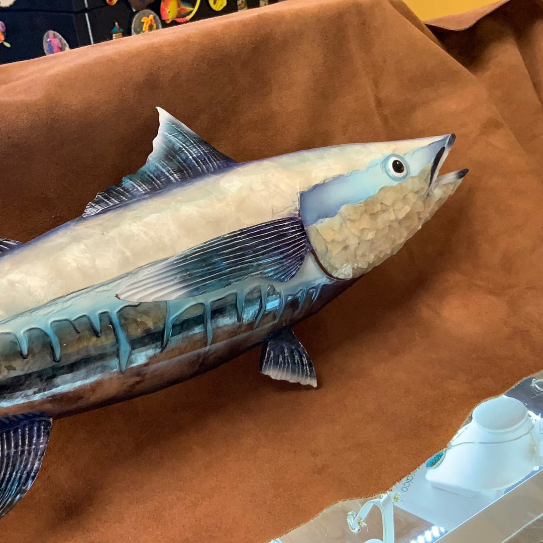 Colorful Decor.  This piece is made from Metal 31 inches Long. This will look great with any home Decor. Transform your home into a work of art with our stunning Blue and White Capiz Wall Art Tuna. Made with high-quality metal, this 31-inch long piece adds a pop of color and a touch of elegance to any home decor. The perfect addition to enhance the aesthetic appeal of your living space. Boost your home's style and leave a lasting impression on your guests.