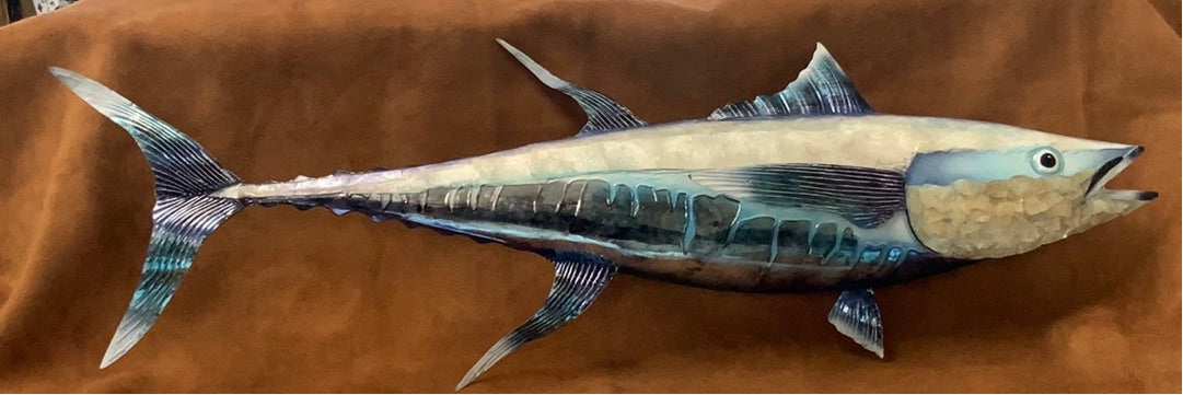 Colorful Decor.  This piece is made from Metal 31 inches Long. This will look great with any home Decor. Transform your home into a work of art with our stunning Blue and White Capiz Wall Art Tuna. Made with high-quality metal, this 31-inch long piece adds a pop of color and a touch of elegance to any home decor. The perfect addition to enhance the aesthetic appeal of your living space. Boost your home's style and leave a lasting impression on your guests.
