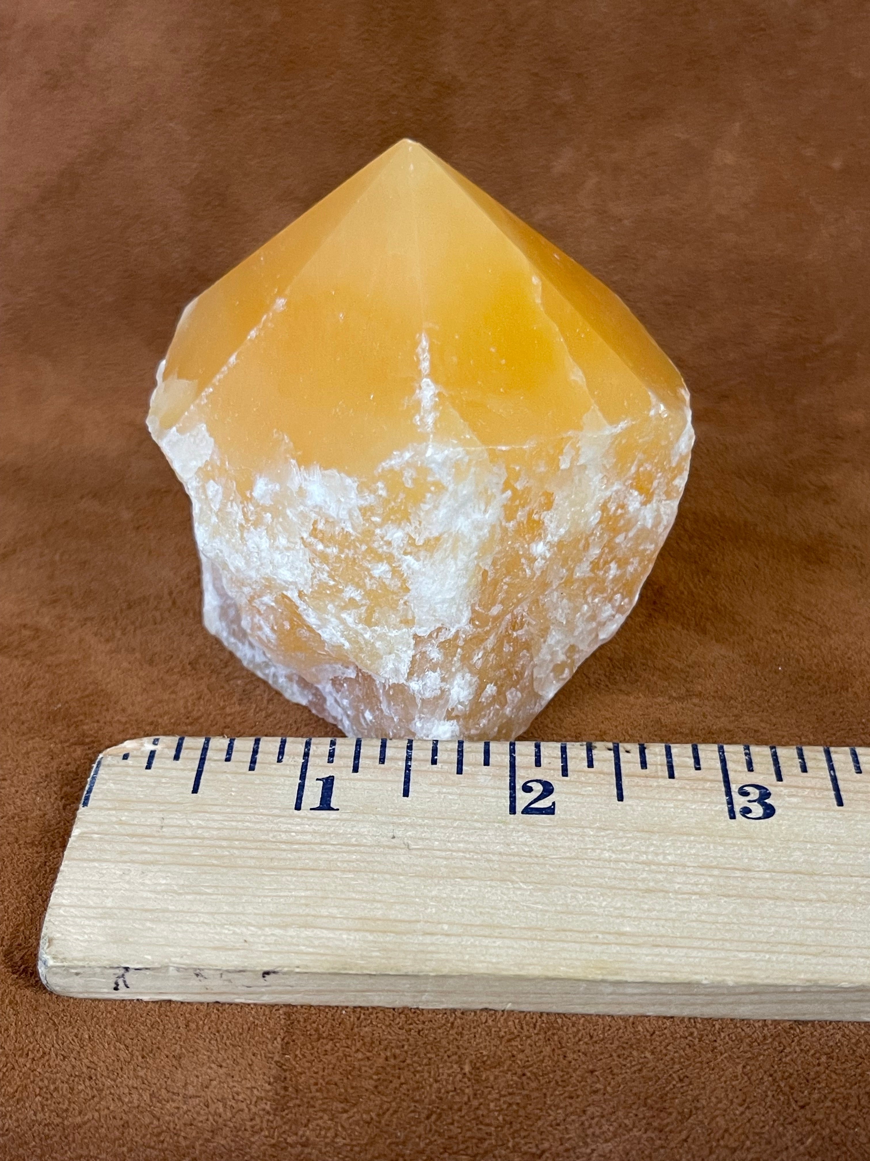 Orange calcite polished point