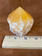 Orange calcite polished point